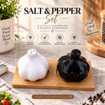 garlic shaped salt and pepper shakers, ceramic salt and pepper shaker set, black and white salt pepper shakers, garlic ceramic seasoning set, salt pepper set with bamboo tray, garlic shaped ceramic shakers, 3 piece salt and pepper set, cute kitchen accessories, decorative salt and pepper shakers, bamboo tray seasoning set, ceramic salt pepper containers, black white kitchen accessories, modern dining table accessories, salt pepper shaker set Pakistan, ceramic shakers Pakistan, bamboo tray salt pepper set Pa