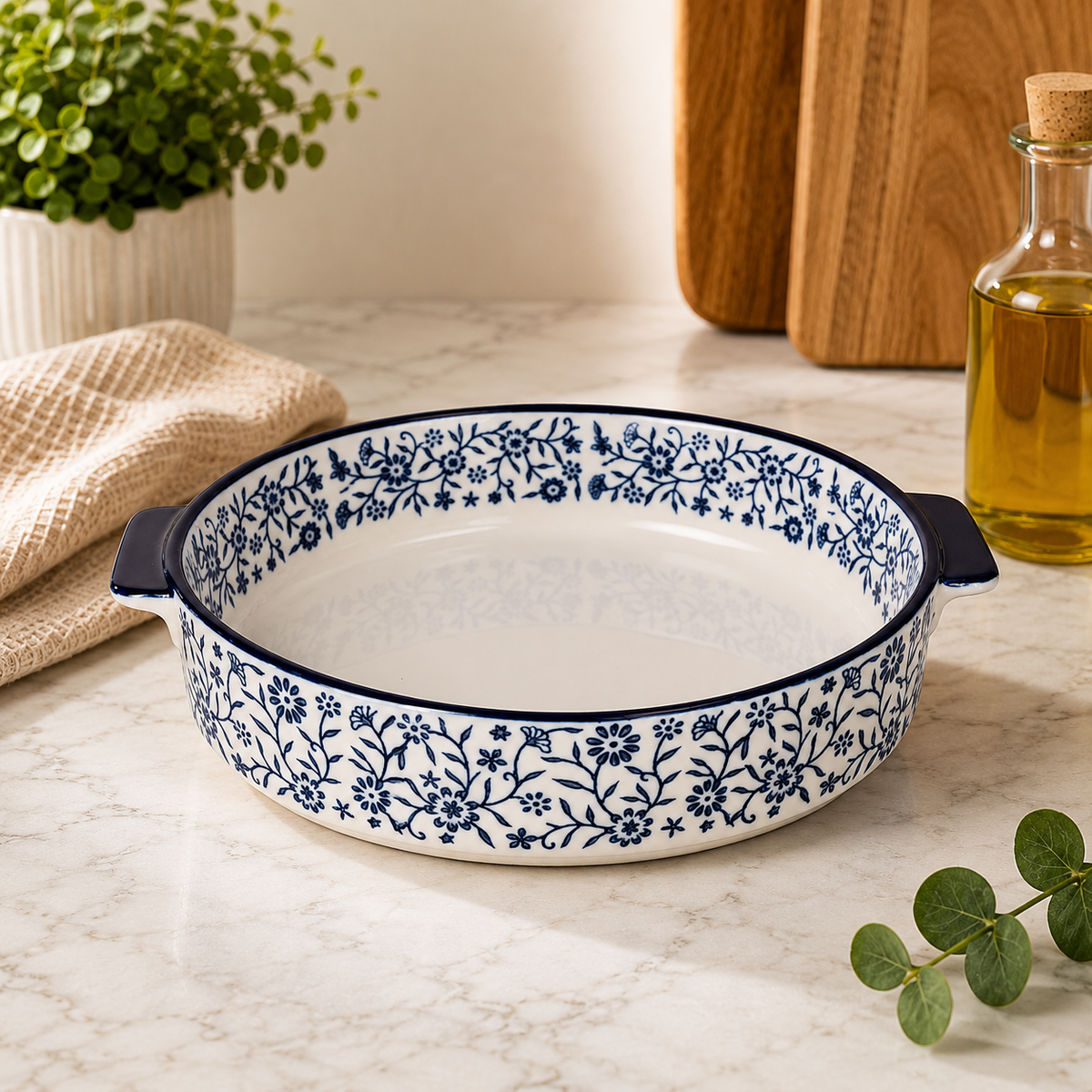 DANNY HOME 8-inch round ceramic baking dish with blue floral pattern and integrated side handles for baking and serving.