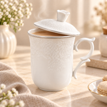embossed floral ceramic mugceramic mug with lidfloral coffee mugpremium ceramic coffee mugceramic tea cup with liddecorative handle mugelegant coffee mugaesthetic ceramic mugceramic mug Pakistancoffee mug with lid PakistanElegant embossed floral ceramic mug with matching lid and decorative handle for serving tea, coffee and hot beverages at home or office.