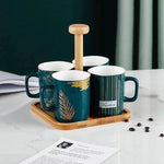 Emerald Luxe 4-Piece Green and Gold Ceramic Mug Set with Bamboo Stand & Tray – Home Hatch Pakistan
