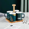Emerald Luxe 4-Piece Ceramic Mug Set with Bamboo Stand & Tray – Green & Gold Design