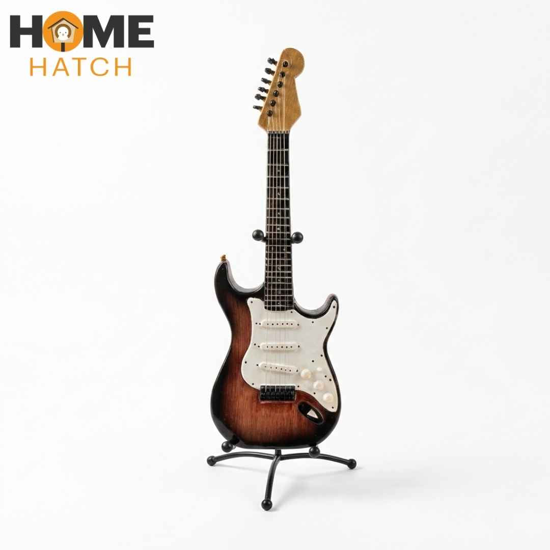 Mini electric guitar decoration showpiece with stand on white background front view