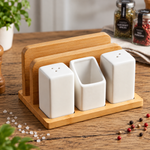 4 in 1 salt pepper shaker setsalt and pepper shaker setbamboo kitchen organizernapkin and toothpick holderceramic salt pepper shakerdining table organizerbamboo napkin holdersalt pepper toothpick holderkitchen table organizersalt pepper set Pakistan
