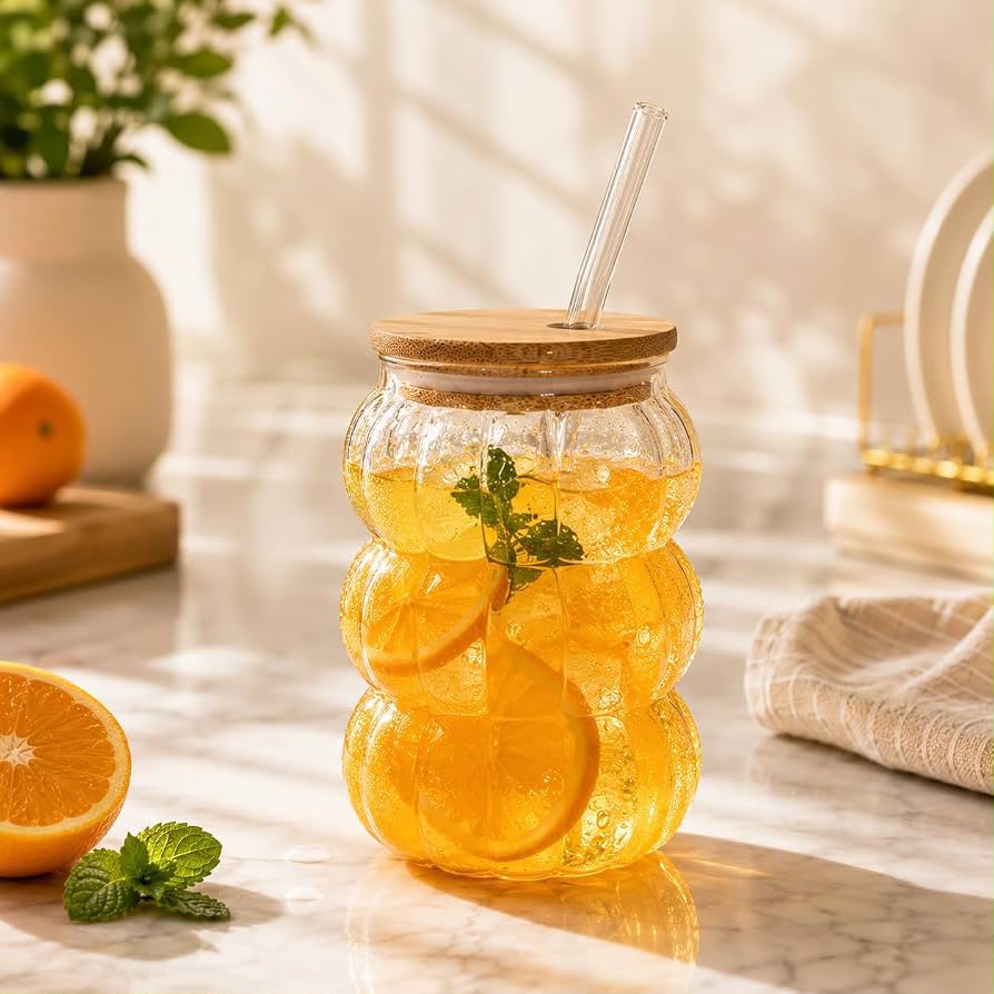 600ml pumpkin shape transparent glass tumbler with wooden lid and reusable glass straw for iced coffee, juice, smoothies and cold beverages.