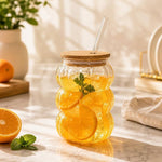 600ml pumpkin shape transparent glass tumbler with wooden lid and reusable glass straw for iced coffee, juice, smoothies and cold beverages.
