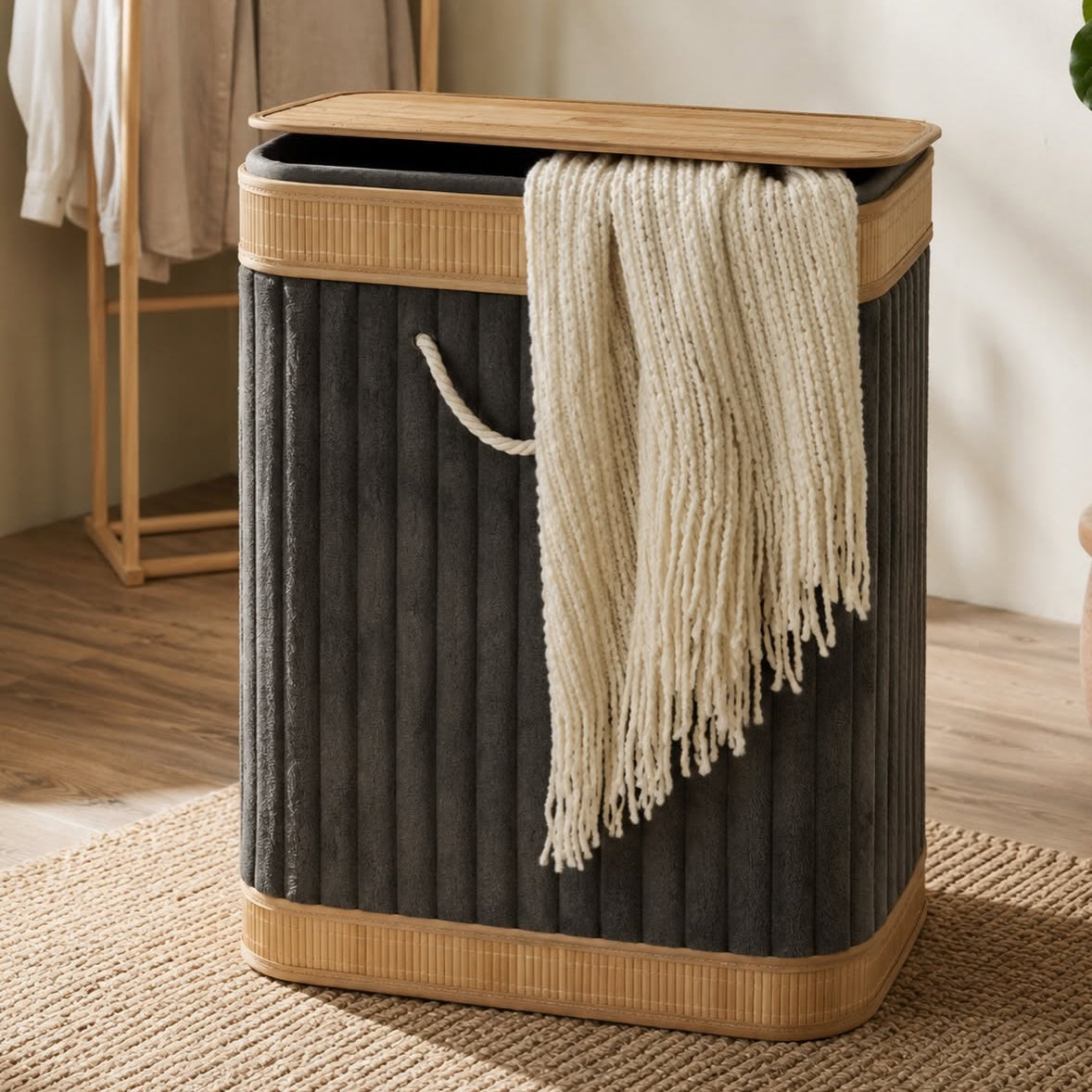 Grey velvet laundry basket with bamboo frame and lid, foldable clothes storage hamper for bedroom, bathroom, and laundry room organization.