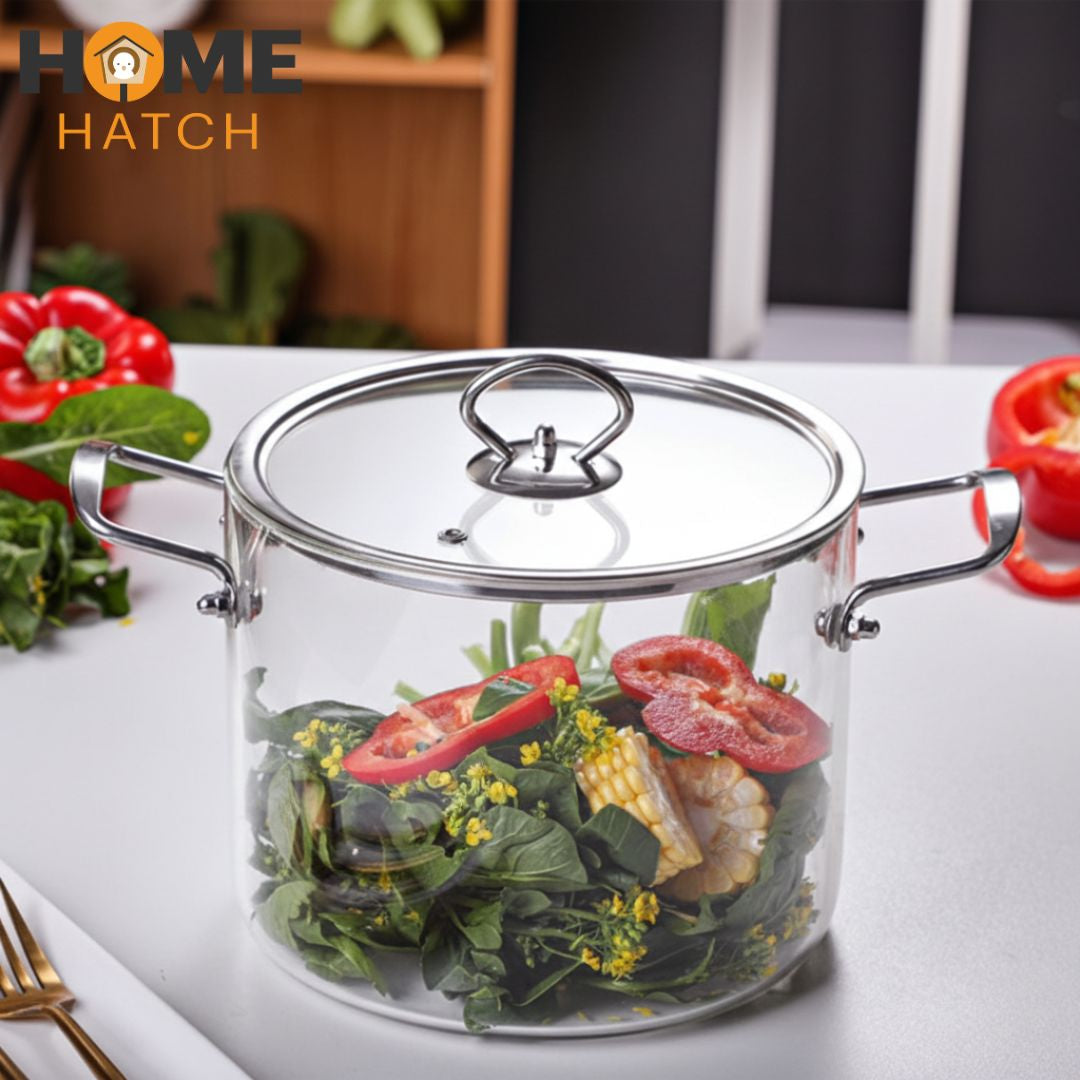 Clear glass pot with lid containing vegetables on a white surface