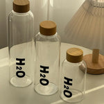 Borosilicate Glass Water Bottle with Wooden Cap – Leakproof H2O Style – Home Hatch Pakistan