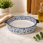 DANNY HOME 8-inch round ceramic baking dish with blue floral pattern and integrated side handles for baking and serving.