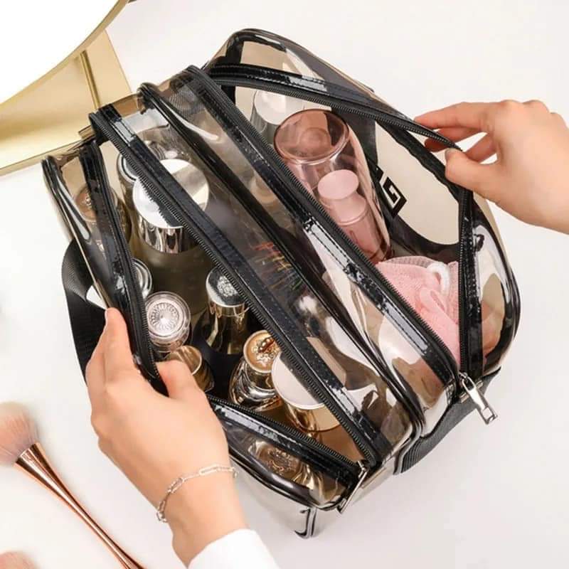 Transparent multi-layer cosmetic and toiletry organizer bag with zippered compartments, carrying handles, and large capacity by Home Hatch