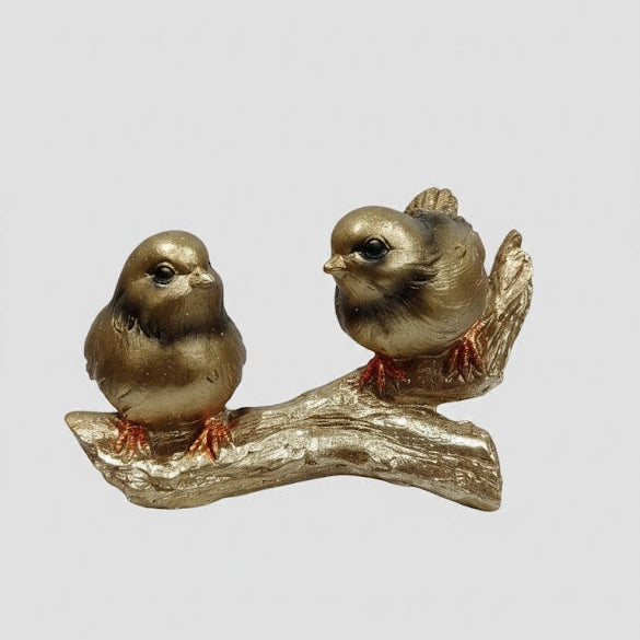 Golden bird couple decorative showpiece on a branch for home décor