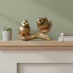Golden bird couple decorative showpiece on a branch for home décor