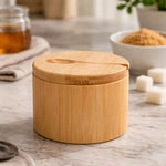 Natural bamboo sugar bowl with small spoon and magnetic swivel lid for storing sugar, salt, spices and kitchen seasonings.bamboo sugar bowlsugar bowl with spoonbamboo sugar bowl with lidmagnetic lid sugar bowlwooden sugar containerbamboo spice containersugar storage containersalt and spice containerbamboo kitchen organizerbamboo sugar bowl Pakistan
