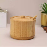 Natural bamboo sugar pot with matching lid and spoon for storing sugar, salt, spices and seasonings on kitchen counters and dining tables.bamboo sugar potbamboo sugar bowlsugar bowl with lid and spoonwooden sugar bowlbamboo sugar containerwooden spice containersugar storage containerbamboo salt containerbamboo kitchen storagebamboo sugar pot Pakistan