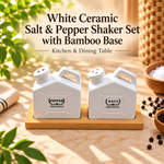 White ceramic salt and pepper shaker set of 2 with natural bamboo base for kitchen and dining tablewhite ceramic salt and pepper shaker set, ceramic salt pepper shakers, salt pepper set with bamboo base, bamboo salt pepper set, white seasoning shakers, ceramic seasoning set, minimalist salt pepper shakers, salt pepper set with bamboo tray, kitchen seasoning set, dining table seasoning set, ceramic kitchen accessories, bamboo kitchen accessories, dining table accessories, salt and pepper shakers Pakistan, c