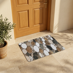 Pebble-pattern mat at a sheltered sunlit entrance